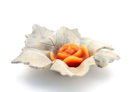 Leaf with candle isolated on white backgroundの写真素材
