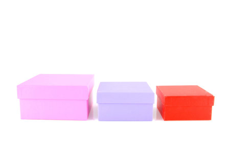 three colored packaging boxes isolated on white background