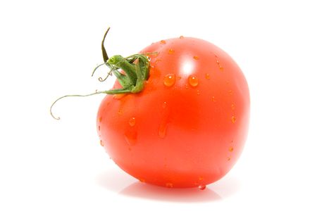 One red tomato with water drops isolated on white backgroundの写真素材