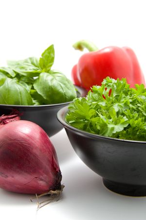 fresh dinner ingredients with basil, parsley, red onion and paprikaの写真素材