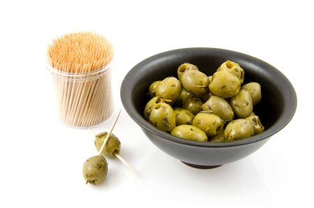 Bowl with fresh gren olives isolated on white backgroundの写真素材