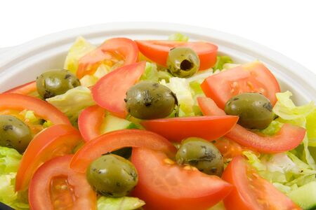White bowl with fresh salad isolated on white backgroundの写真素材