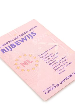 Dutch drivers license isolated on white backgroundの写真素材