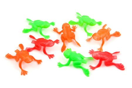 colorful plastic frog toys isolated on white backgroundの写真素材