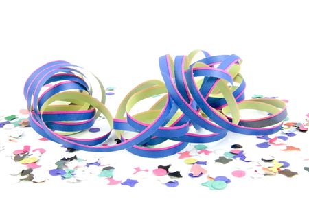 blue pink colored party streamer with confetti over whiteの写真素材