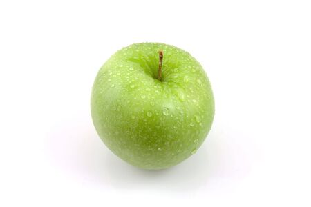 Fresh juicy green apple with water drops isolated on white backgroundの写真素材