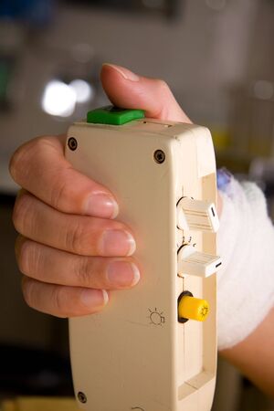 a patient's hand is pushing the nurse call button in hospitalの写真素材