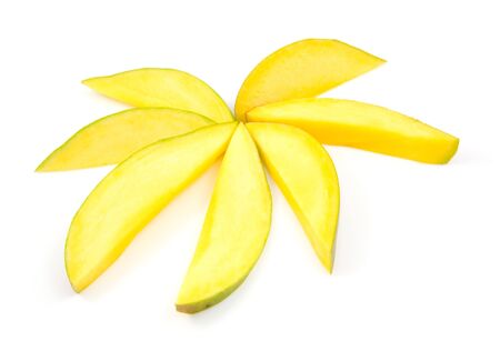 Slices of fresh mango in shape of star isolated on white backgroundの写真素材
