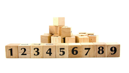 Row wooden blocks with numbers 1 to 9 isolated on white backgroundの写真素材