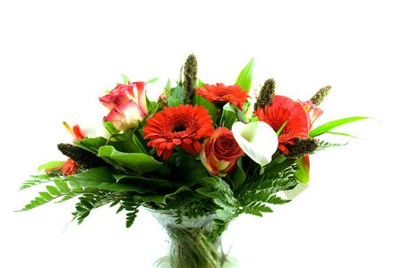 Bouquet of flowers in glass vase isolated on white backgroundの写真素材