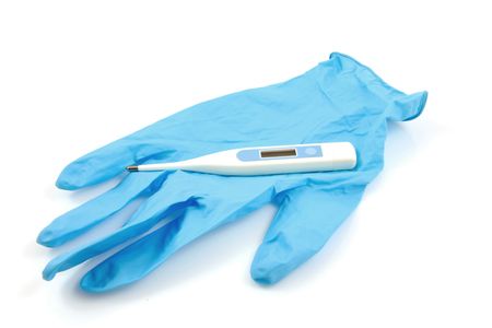 Health care: thermometer and blue glove from hospital. Isolated on white backgroundの写真素材