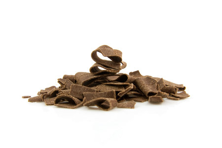 pile of Dutch chocolate flakes sprinkles isolated on white backgroundの写真素材