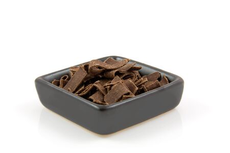 Bowl with Dutch chocolate flakes sprinkles isolated on white backgroundの写真素材