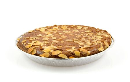 Typical filled Dutch pie with almond for Sinterklaas, isolated on white backgroundの写真素材