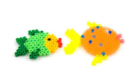 Bead arts in the shape of fishl isolated on white backgroundの写真素材