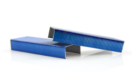 blue colored staples isolated on white background