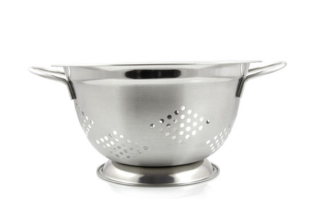 empty steel colander isolated on white backgroundの写真素材