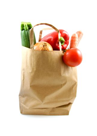paper shopping bag with grocery over white backgroundの写真素材