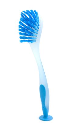 Standing blue dishwashing brush isolated on white backgroundの写真素材