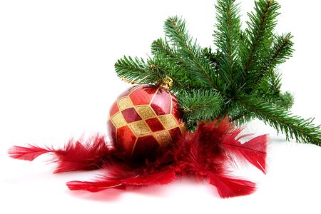 christmas ball with feathers and tree as decoration, over white backgroundの写真素材