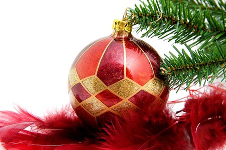 christmas ball with feathers and tree as decoration, over white backgroundの写真素材