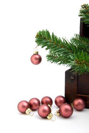 wooden box with christmas decoration over white backgroundの写真素材