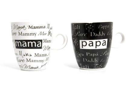 Coffee mugs with text Mom and  Dad over white backgroundの写真素材
