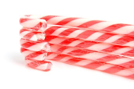 stacked christmas candy cane over white backgroundの写真素材