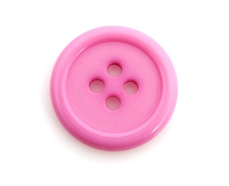 Closeup of pink clothing button isolated on white backgroundの写真素材