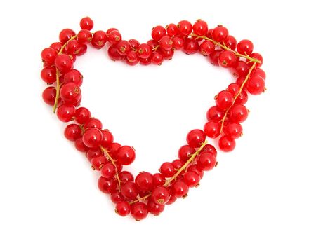 red berries in the shape of heart over white backgroundの写真素材