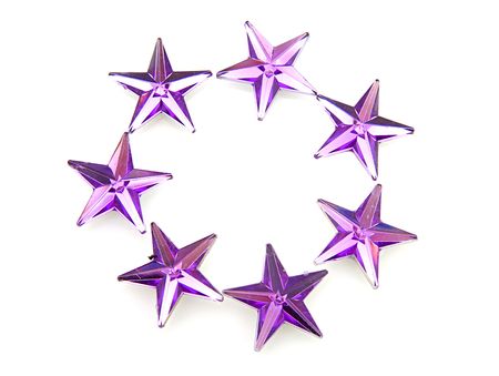 Purple stars confetti over white backgroundの写真素材