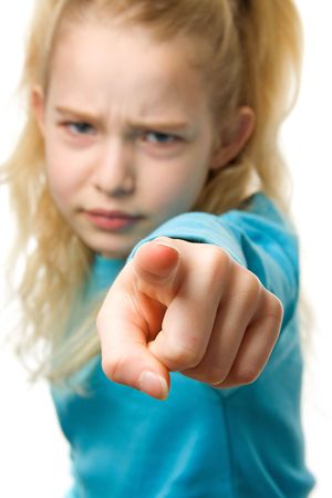 Angry girl is pointing at you, finger closeup, girl in blurの写真素材