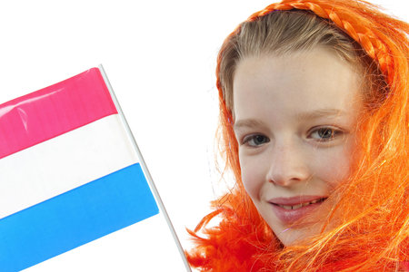 Girl is posing in orange outfit for soccer game or queensday over white backgroundの写真素材