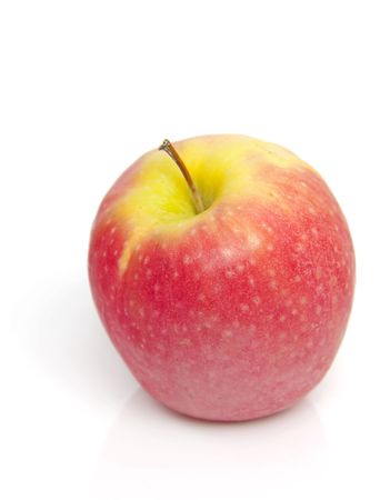 red apple in closeup over white backgroundの写真素材