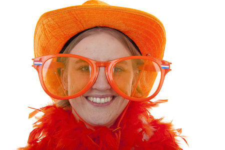 portrait of a soccer supporter with big orange glasses over white backgroundの写真素材