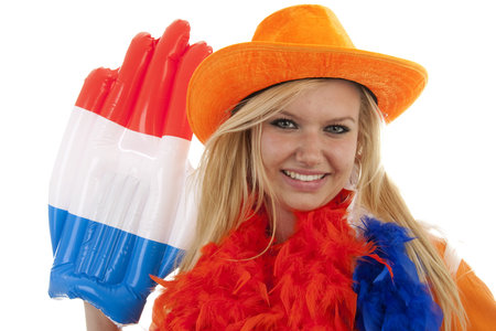 portrait of Dutch soccer fan in orange outfit with big glasses, hat and big hand over white backgroundの写真素材