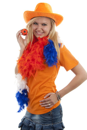 portrait of Dutch soccer fan in orange outfit over white backgroundの写真素材