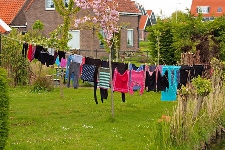 Laundry hanging on clothesline in the village Marken, Netherlandsの写真素材