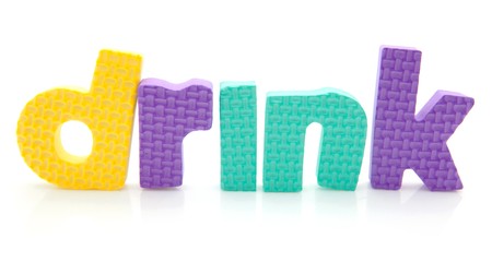 Word drink in colorful foam letters over white backgroundの写真素材