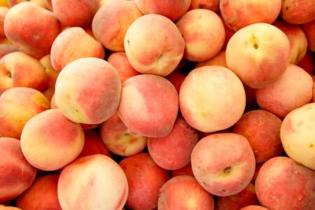 group of fresh peaches in closeup can be used as backgroundの写真素材