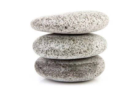 stack of grey stones over white backgroundの写真素材