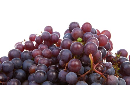 Pile of juicy fresh blue grapes over white backgroundの写真素材
