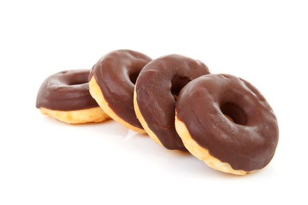 delicious chocolate donuts over white backgroundの写真素材