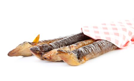 pile of Dutch smoked eel under napkin isolated on white backgroundの写真素材