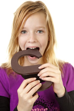 Girl with big chocolate letter for Sinterklaas, traditional in the netherlands, over white backgroundの写真素材