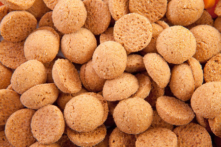 background of typical dutch sweets: pepernoten (ginger nuts) for a celebration at 5 december in the Netherlandsの写真素材