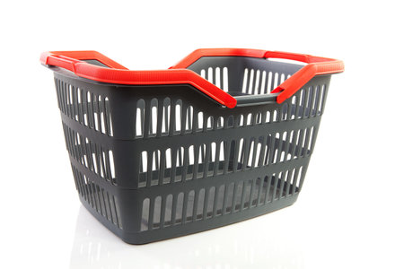 empty grey shopping basket with red handles isolated on white backgroundの写真素材