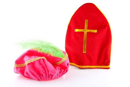 Mitre of sinterklaas and hat of zwarte piet ( black pete), part of typical dutch event in decemberの写真素材