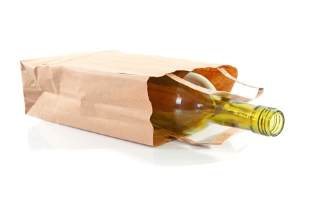 paper bag with bottle inside over white backgroundの写真素材