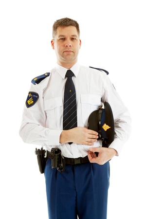 Dutch police officer looking into camera over white background holding hatの写真素材